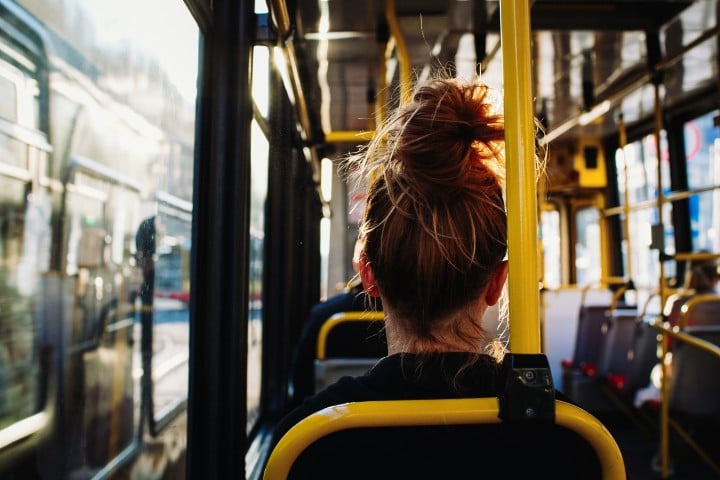 female sitting bus