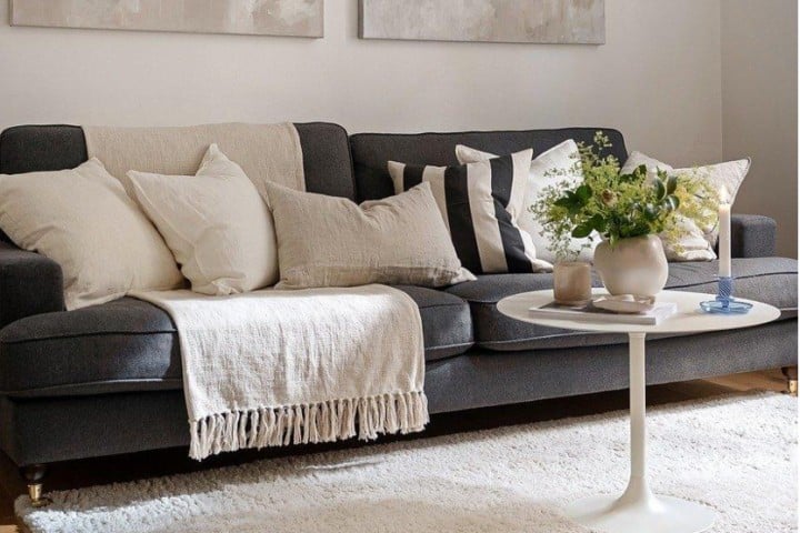 grey armchair with white cushions