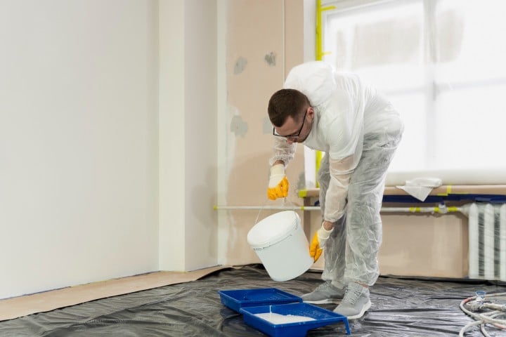 professional painter painting house