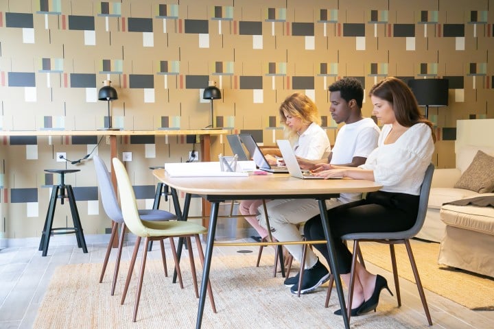 team focused sitting togheter table