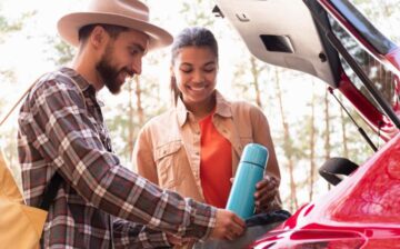 couple loading the car on moving day