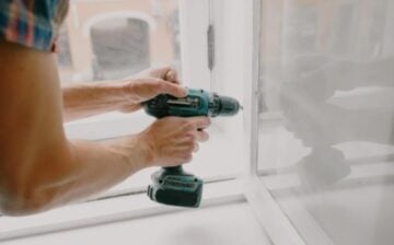 man fixing his house