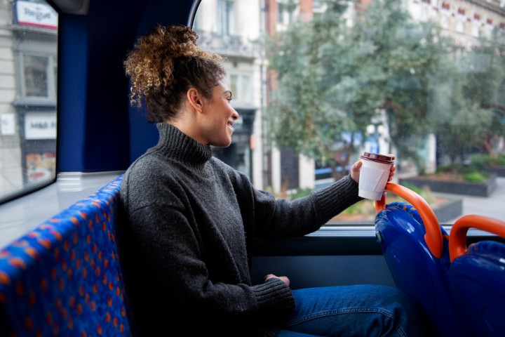 young woman riding bus city to nyc