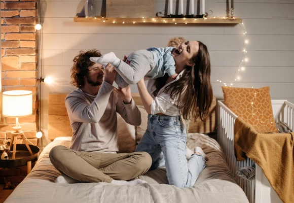 a couple holding a new born baby