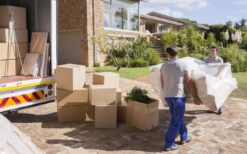 movers moving overstuffed chair