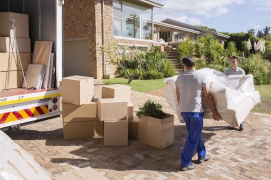 movers moving overstuffed chair