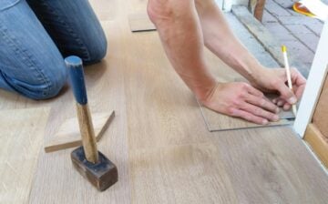 worker measures floor