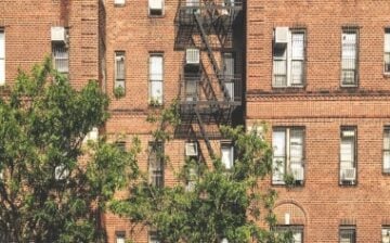 Exterior of residential building with fire escape ladders